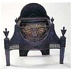 A cast iron serpentine fire grate in Adam style with an arched back, a sunburst front and cornucopia