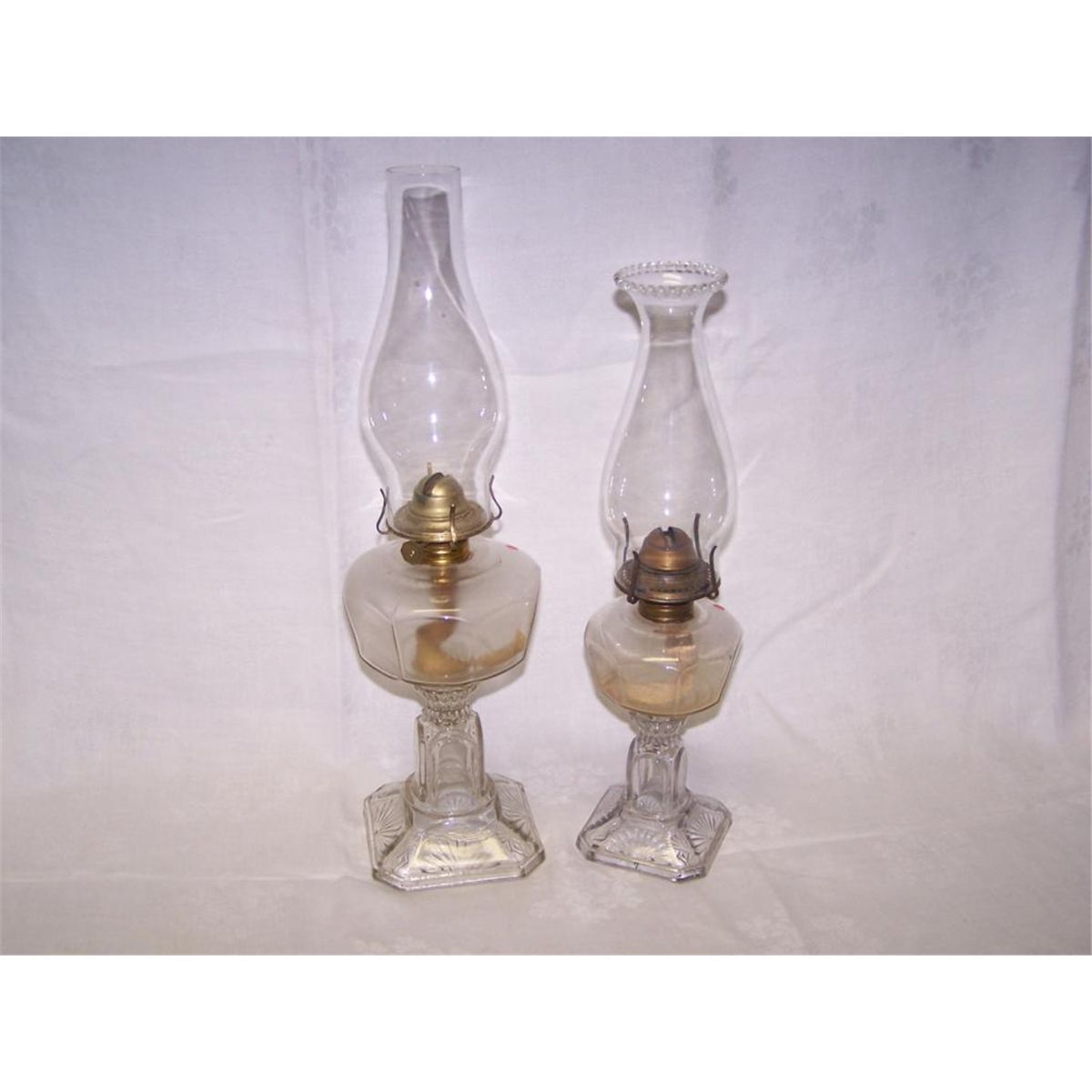 2 Pedestal coal oil lamps.