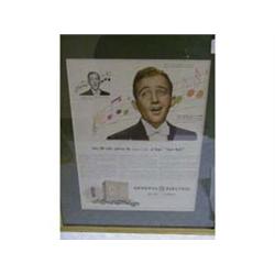 A FRAMED ADVERTISING POSTER "GENERAL ELECTRIC F.M. RADIO", PICTURING BING CROSBY.