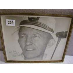 A FRAMED BLACK & WHITE PHOTOGRAPH, BING CROSBY PLAYING GOLF "ALL BEST WISHES BING CROSBY" (SMUDGED).
