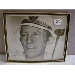A FRAMED BLACK & WHITE PHOTOGRAPH, BING CROSBY PLAYING GOLF, SIGNED "WARMEST REGARDS BING CROSBY".