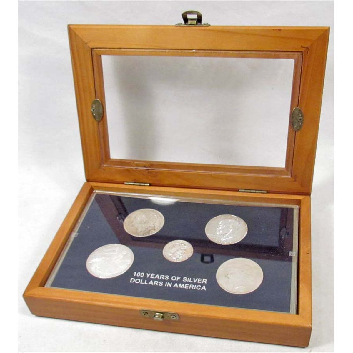 SET OF US SILVER DOLLARS IN DISPLAY CASE