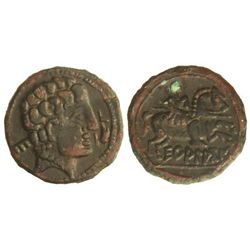 As. - ECUALACOS. - Anv.: Cabeza viril a derecha, detrás letra ibérica, delante delfín. Rev.: Jinete