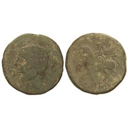 As. - ICALCUNSCEN. - Anv.: Cabeza masculina a izquierda, delante caduceo, detrás delfín. Rev.: Jinet