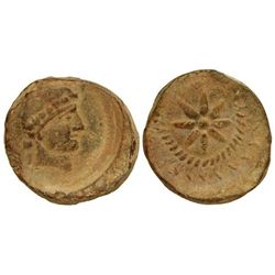 Plomo monetiforme. - MALACA. - Anv.: Cabeza de Vulcano a derecha con gorro cónico, detrás (leyenda n