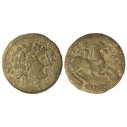 As. - OILAUNICOS. - Anv.: Cabeza barbada a derecha, delante signos ibéricos SOS, detrás glóbulo. Rev