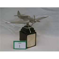 Presentation model of spitfire on wooden base with silver plaque.