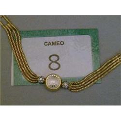 Omega ladies 18ct gold dress watch with two crowned settings each containing seven diamonds.