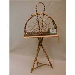 Unusual Victorian magazine rack made of decorative and turned metal.