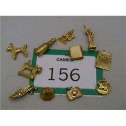 Eleven 9ct gold charms.