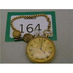 18ct fuse movement, half hunter pocket watch with decorated fob, in working order with key and origi