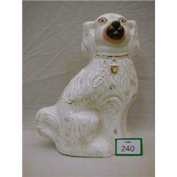 Large Staffordshire white and gilt spaniel, hairline crack to base.