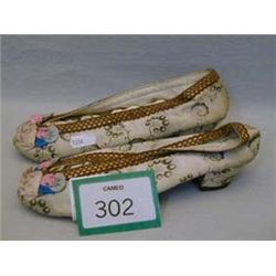 Pair of early 19th century silk slippers with leather soles.