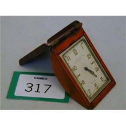 Unusual travelling alarm clock in the shape of a blotter, marked Goldsmith & Silversmith Co..