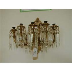 Bronze five branch wall light with cut glass drops.