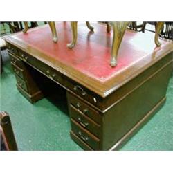 Mahogany pedestal partners desk, approx. 60" x42" comprising twelve drawers and two cupboards with r