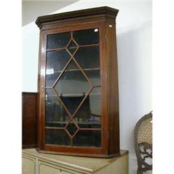 Mid Victorian mahogany glazed corner cupboard with astral glass, shaped shelf and dental design to f