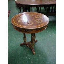 Superb oval occasional table with marquetry top, brass banded rim on three shaped columns with ormal