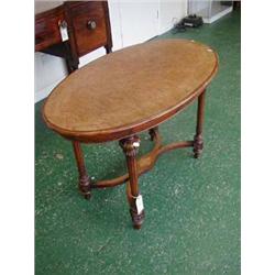 Superb burr walnut oval centre table with satinwood inlay on turned and reeded legs, bears registrat
