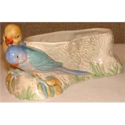 A  Clarice Cliff planter, in beige colouring