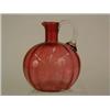 Image 1 : A Victorian cranberry glass jug, of panelled