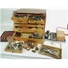 Image 1 : A cabinet of watchmakers spares, tools, ac...