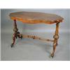 Image 1 : A Victorian walnut centre table with a ser...