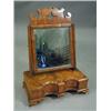 Image 1 : A walnut toilet mirror, on shaped stand, w...