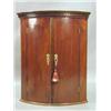 Image 1 : A George III mahogany bow fronted hanging ...