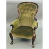 Image 1 : A Victorian carved button back armchair...