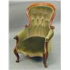 Image 1 : A Victorian carved button back armchair...