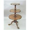 Image 1 : A George III mahogany dumb waiter with 3 s...