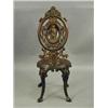 Image 1 : A Victorian cast iron chair, the back with...