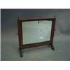 Image 1 : A 19th century mahogany swing frame mirror...