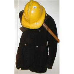 A c1960's fire mans uniform, helmet and ax...