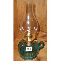 A late C19th blue glass hand oil lamp with...