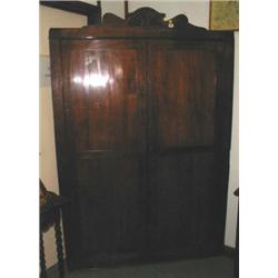 A large C19th mahogany corner cupboard/war...