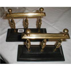 A pair of C19th cast iron and brass fire d...