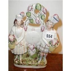 A C19th Staffordshire flat-back comprising...