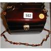 Image 1 : A Lucite barrel shapped handbag...