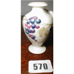 A miniature signed Moorcroft vase with gra...