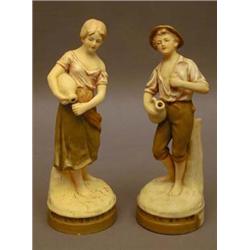 A pair of Royal Dux figures of water carr...