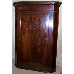 A George III Mahogany Corner Cupboard with...