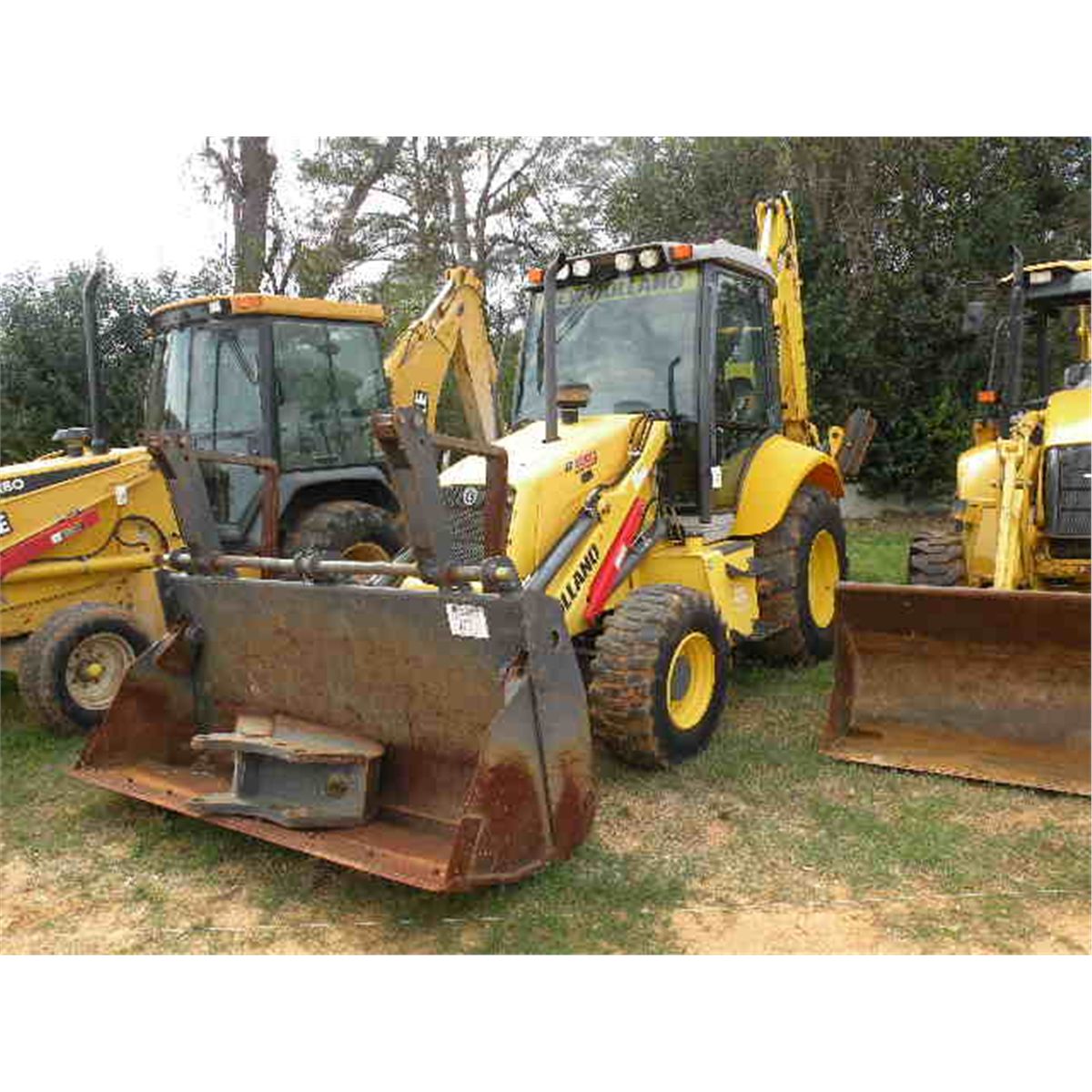 NEW HOLLAND B95 4X4 LOADER BACKHOE J.M. Wood Auction Company, Inc.