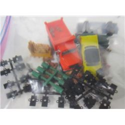 Bag of cars and trucks, people,parts