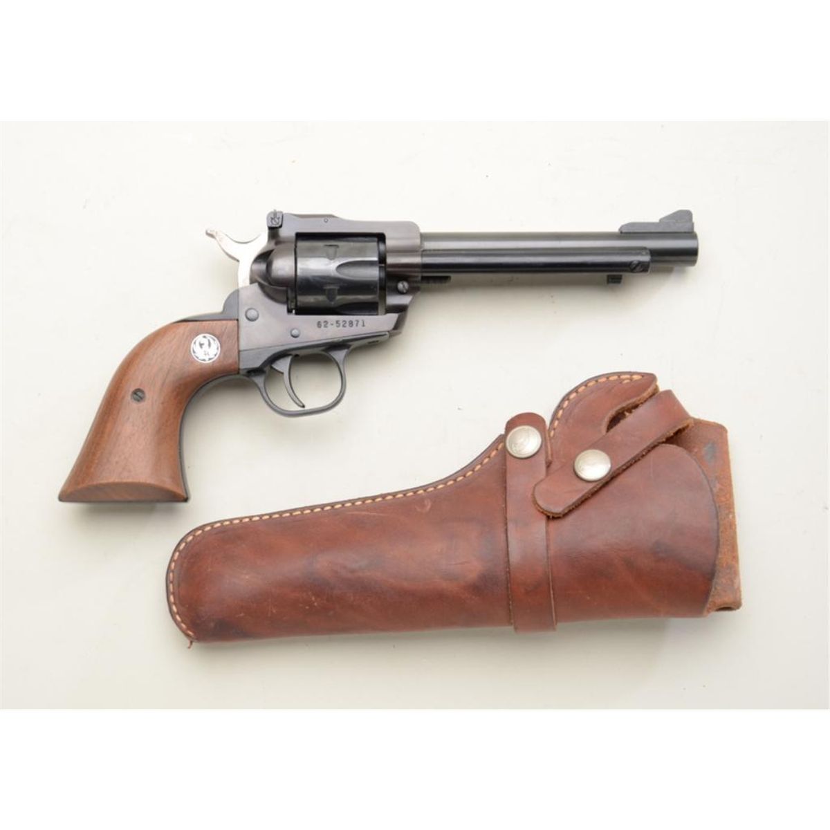 Ruger New Model Single-Six revolver, .22 cal., 5-1/2” barrel, black finish, wood medallion grips,