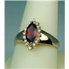Image 2 : Stylish 14 karat yellow gold ladies ring set  with a center MQ cut garnet weighing approx.  2.00 car