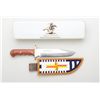 Image 1 : Large Winchester Model 94 Commemorative Bowie  knife with modern beaded leather sheath,  both in ove
