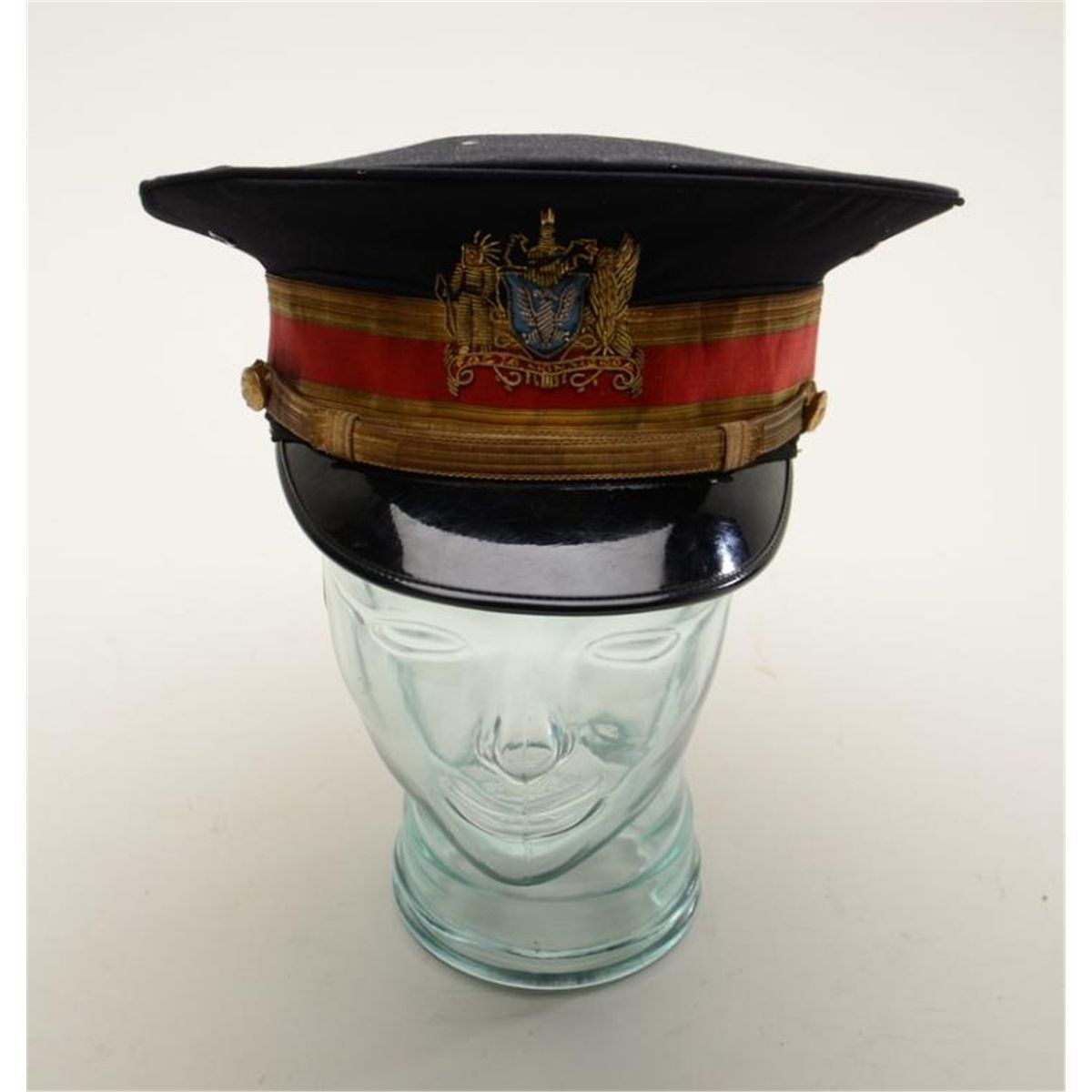 Interesting military uniform items including a dress hard brim hat with