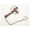 Image 1 : Small iron animal trap with securing chain in  overall good uncleaned condition.  Est.:   $25-$50.